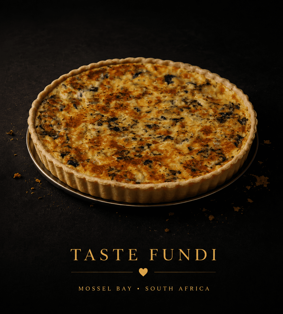 Golden homemade quiche on a dark surface
